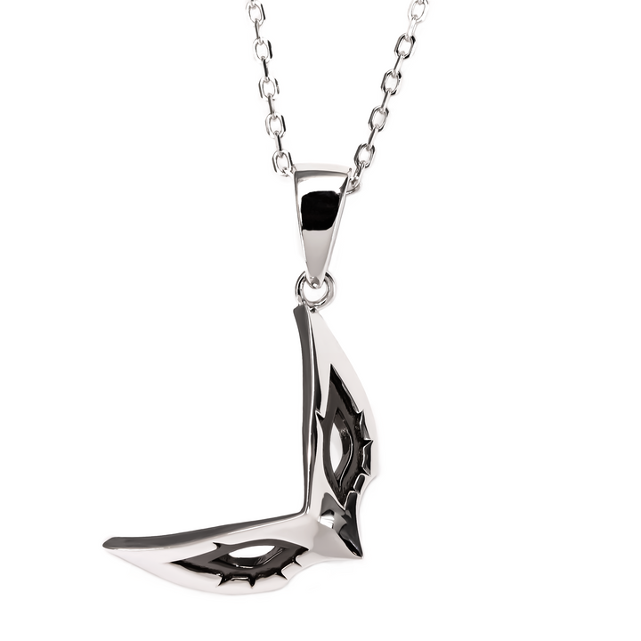 Image of a Joker-themed pendant inspired by Persona 5 Royal, showcasing a detailed black mask design on a silver chain, representing Joker's iconic look and role as the Phantom Thieves' leader.